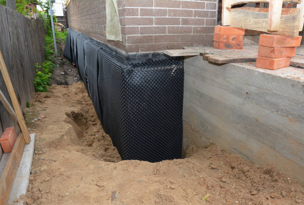 Happy homeowners after waterproofing job in Guild